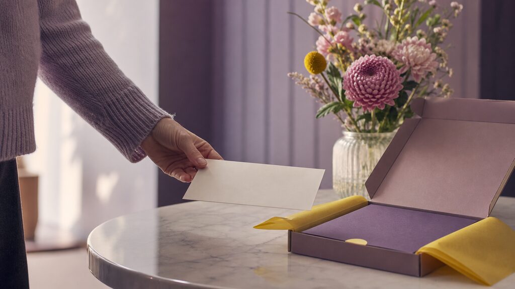 Fresh enquiry card arriving at an otherwise empty welcome desk now prepared with a clear next-step pack