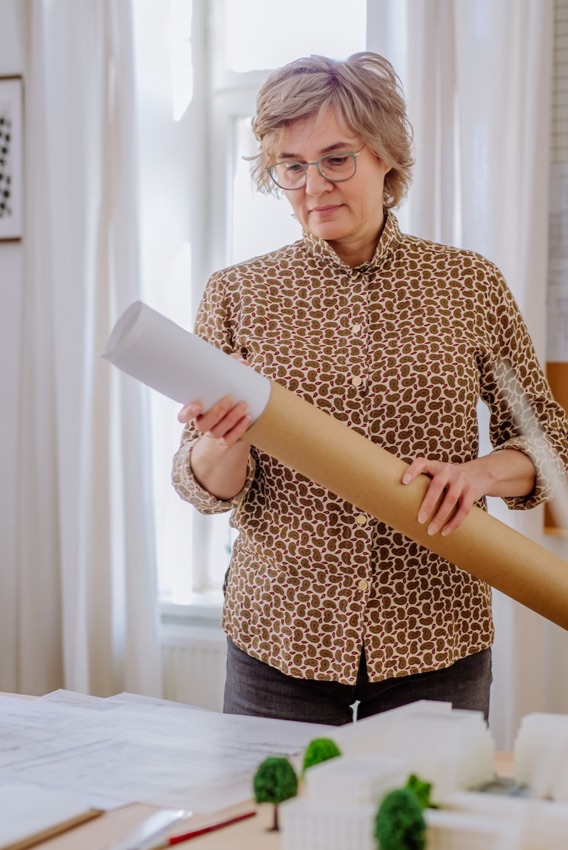 a ceo unrolling a a plan for a building